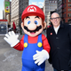 Super Mario posing with the villainous King Koopa